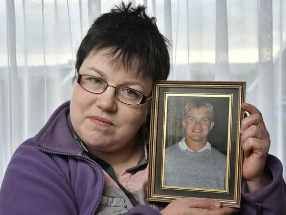 Peter Taylors sister, Nicola, with a photo of her late brother, Peter, who died aged 42 on January 2