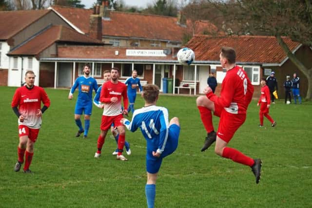 Cayton clear their lines under pressure from an Ayton man. Picture by Steve Lilly.