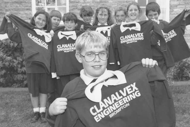 Brompton Primary School football team captain Allan Johnson, front, displayed the team's new strip, watched by team members Judith Wilkinson, Adam Mudd, Steven Appleby, Adam Legg, Laura Wilkinson, Demelza Triffitt, Jennifer Ruston, and Andrew Matthews, in 1995.