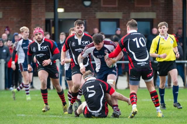 Cade Robinson ploughs forwards