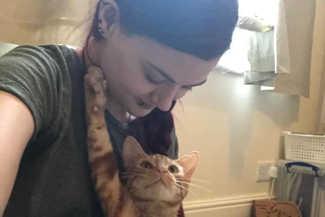 One-year-old ginger tom cat Charlie with his fosterer Claire Louise Welsh.