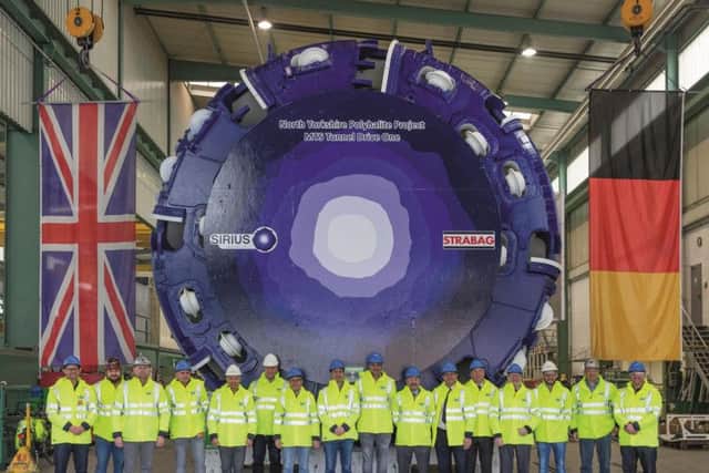 Representatives from Sirius Minerals unveil the first 1,800-tonne tunnel boring machine at a factory in Schwanau, Germany.