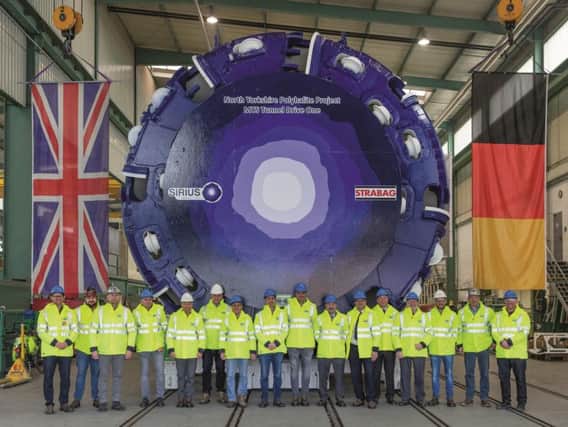 Representatives from Sirius Minerals unveil the first 1,800-tonne tunnel boring machine at a factory in Schwanau, Germany.