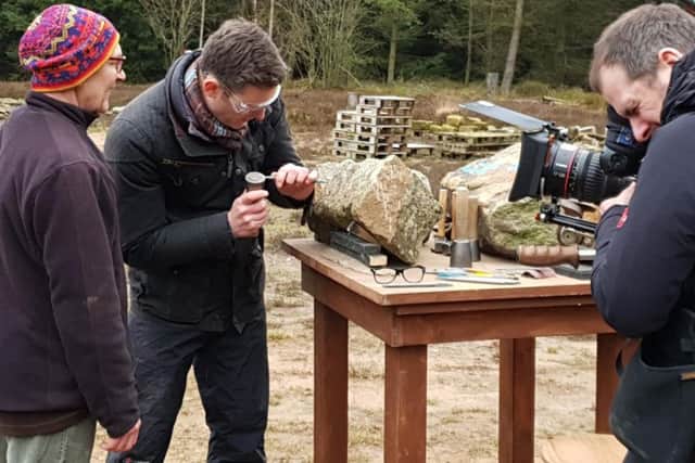 BBCs Matt Baker tries his hand at stone carving at Dalby Forests maze site