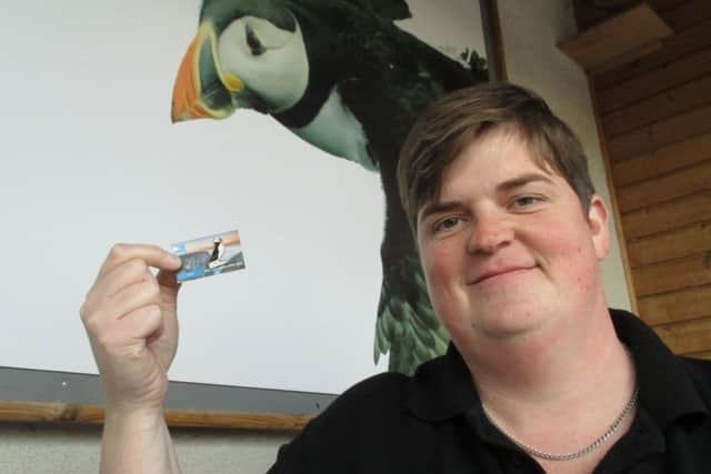 Collector Wendy Knipe is pictured with the limited edition puffin badge.