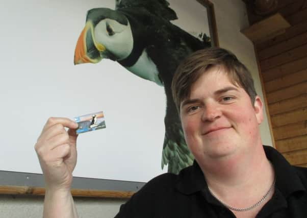 Collector Wendy Knipe is pictured with the limited edition puffin badge.