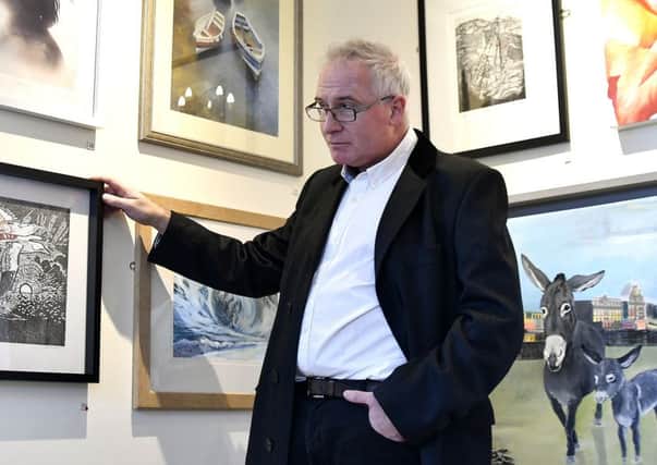 Scarborough Art Gallery host a new open gallery exhibition featuring local artists. Creative director Simon Hedges viewing the exhibition