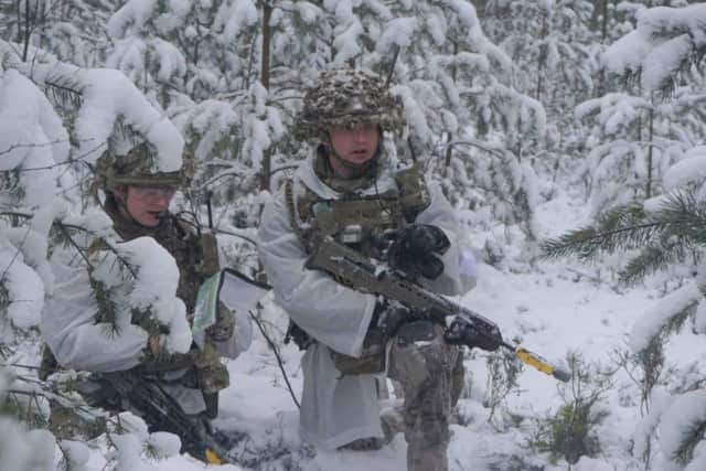 The Yorkshire Regiment soldiers in the snow.
