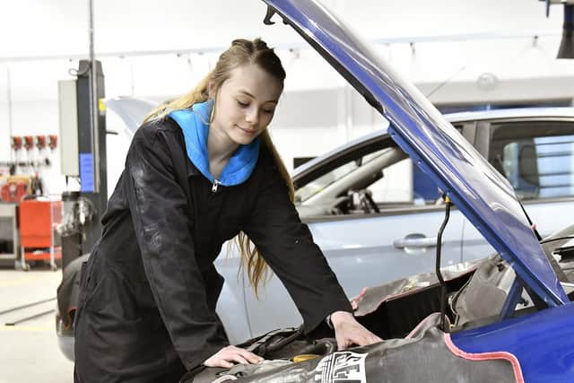 Level 2 motor vehicle student Skye Watton working on one of the vehicles at the college.
