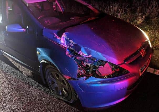 The damage to his car after the collision.