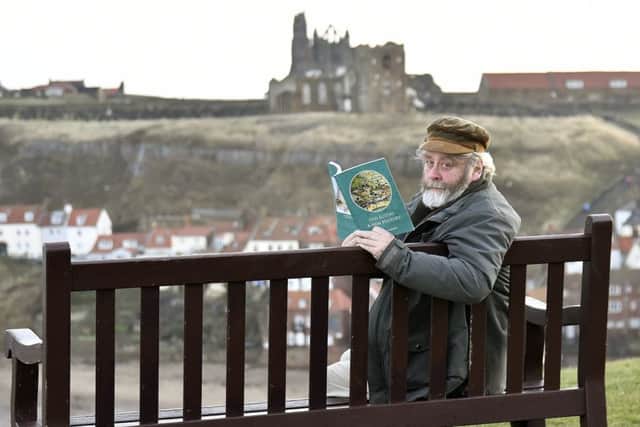 Old Egton Author Alastair Laurence with his book in Whitby. pic Richard Ponter