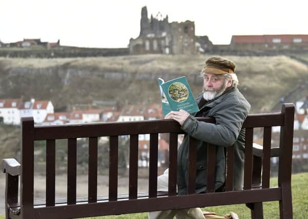 Old Egton Author Alastair Laurence with his book in Whitby. pic Richard Ponter