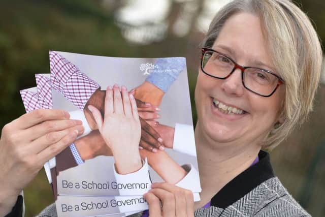 Trish Thistlewood, Governance Manager with Ebor Academy Trust, and the Be a Governor leaflet to encourage people to be a school governor at Braeburn Primary and Nursery Academy.