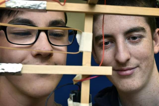 Scarborough TEC students David and Lee work to deadline.
