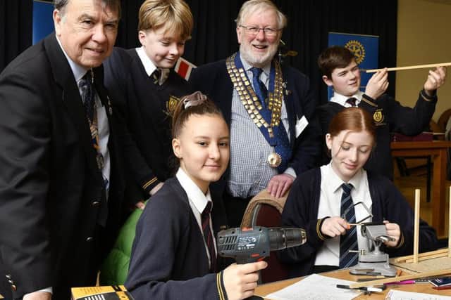 President of the Cavaliers Tony Stevens and Rotary President Ian Holland with St Augustine's pupils Ben, Sienna, Lois and Louis.