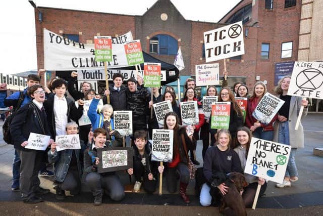 Students join an international protest to call for urgent action to tackle global warming.