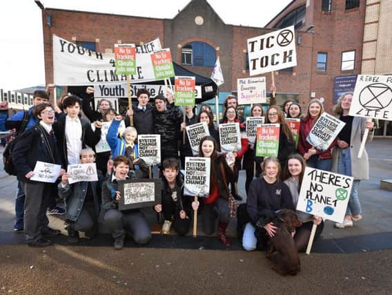 Students join an international protest to call for urgent action to tackle global warming.