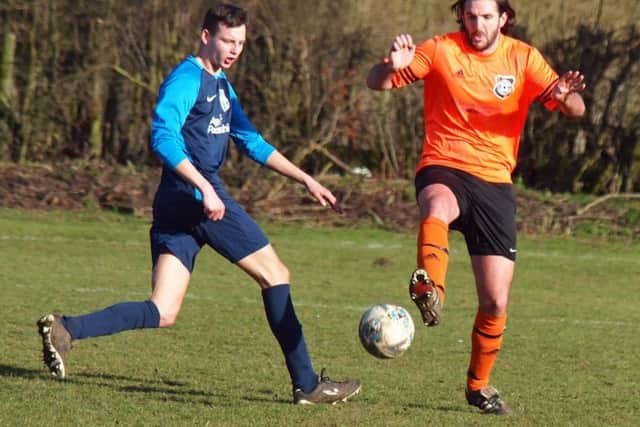 Snainton, orange kit, battle it out in their 5-0 home win against FC Rosette