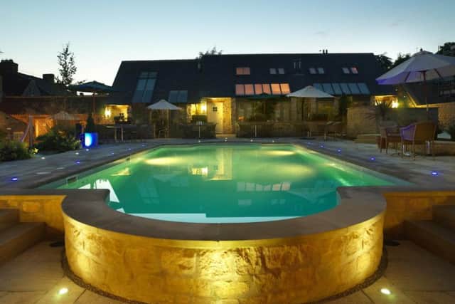 The outdoor pool lit up at night