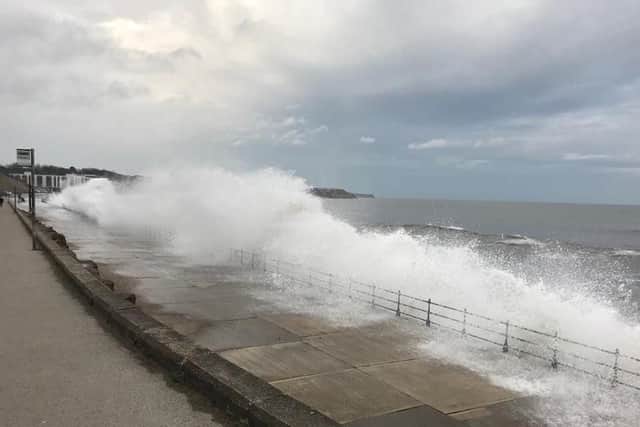A section of Marine Drive has been closed due to waves overtopping sea defences.