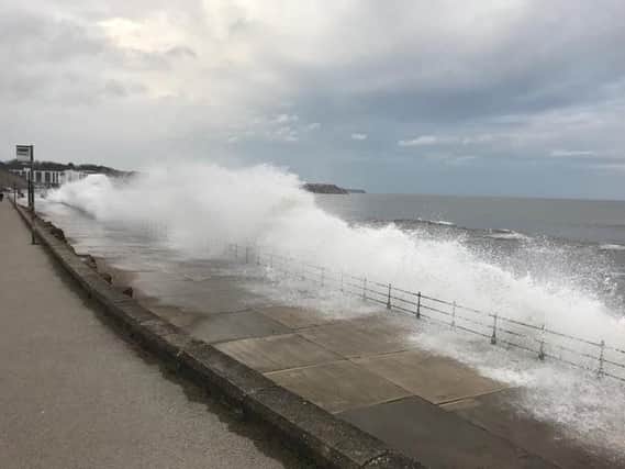A section of Marine Drive has been closed due to waves overtopping sea defences.