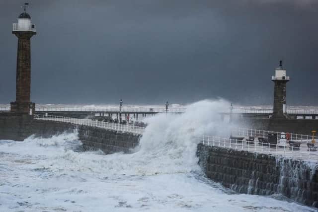 Whitby piers take a battering. Picture by Ceri Oakes.