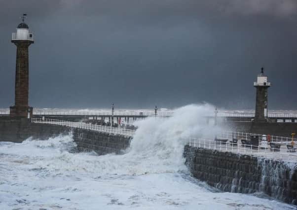 Whitby piers take a battering. Picture by Ceri Oakes.