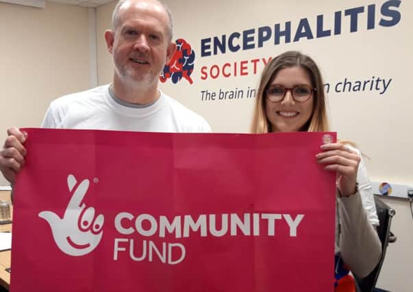 Andrew Cleaton, Trusts and Foundations Coordinator, and volunteer Rebecca Anderson celebrate the Encephalitis Societys £147,500 grant from the National Lottery Community Fund.