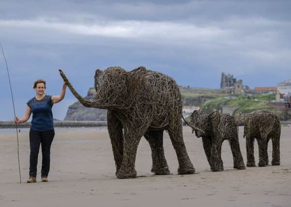 Emma Stothard with her wicker elephants.