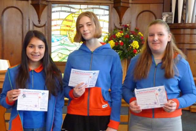 Guides Danielle, Annabel and Willow with their certificates.