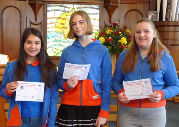 Guides Danielle, Annabel and Willow with their certificates.