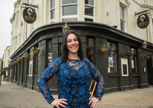 Licensee Kathleen Howard outside the Dickens Bar and Inn on Huntriss Row.