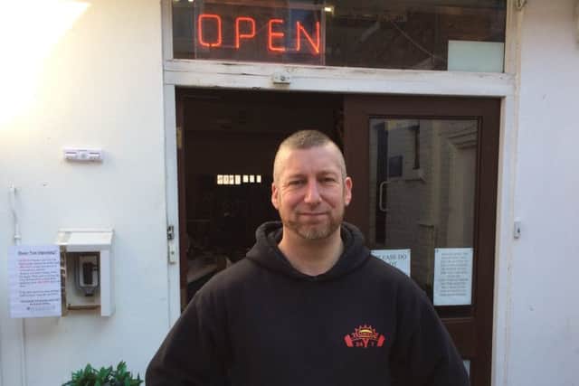 Owner Cyrus Kinge at Sunset 24/7 gym.