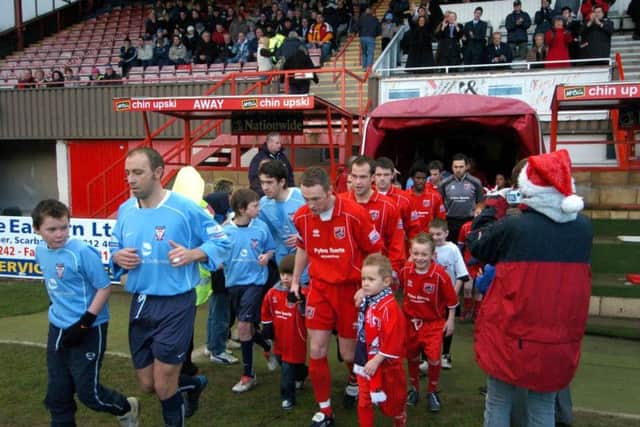 The Scarborough FC and York City teams emerge from the tunnel at the McCain Stadium before the Conference game in December 2004, which ended in a 5-1 win for Boro
