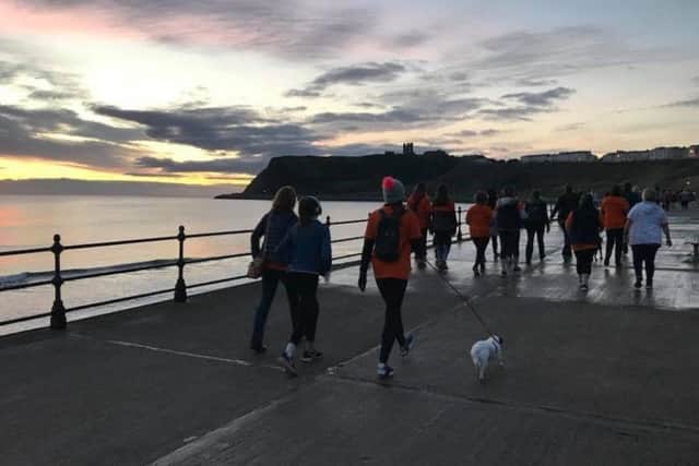 Watch Scarborough light up naturally on the sunrise walk.