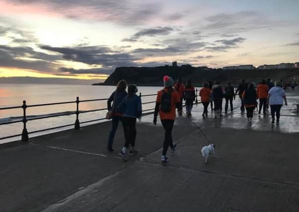Watch Scarborough light up naturally on the sunrise walk.