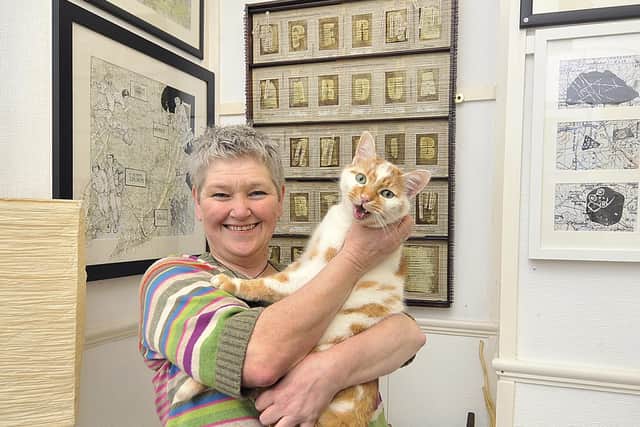 Helen Birmingham with her cat Dr Johnson