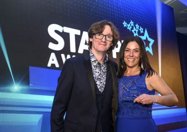 Dickens Bar & Inn licensee Kathleen Howard with comedian Ed Byrne at the Star Pubs & Bars national awards ceremony.