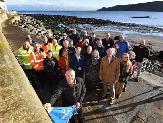 Cllr Bastiman, guests and supporters at the unveiling of the Runswick Bay sea wall.