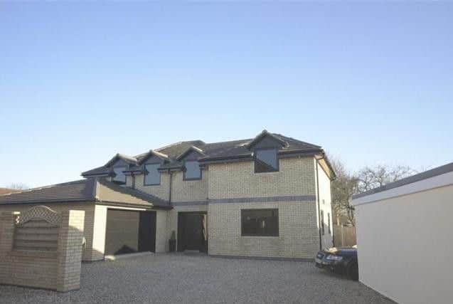 A 21st century home which is one of the most energy efficient properties in the area. The four-bedroom house features a basement area with a home cinema, gym an games room. For sale through D Dunk, Lewis and Graves.