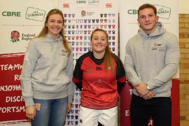 Headlands Schools Melissa Freeman shows off the schools new kit, with England internationals Zoe Aldcroft and Sam Underhill at Twickenham