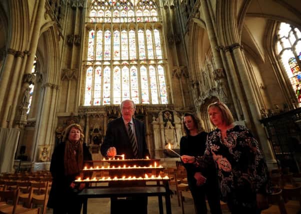 Friends of Claudia Lawrence light candles to mark the 10th anniversary of her going missing at York Minster. Pictured from the left to right are Hazel Dales, Martin Dales, Jen King and Suzy Cooper. Picture by Simon Hulme.