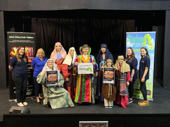 Linda Wood and the staff from Jitterbugs Childcare with cast members from YMCA Theatres Joseph and the Amazing Technicolor Dreamcoat.