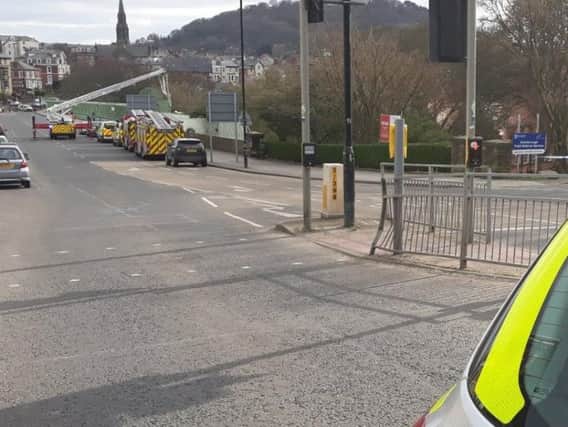 Police have been called out to reports of a person on the wrong side of the bridge railings.