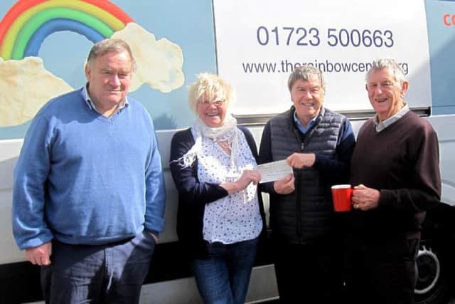 Trish Kinsella at the Rainbow Centre receives a cheque from Rotary president Tony Stevens.