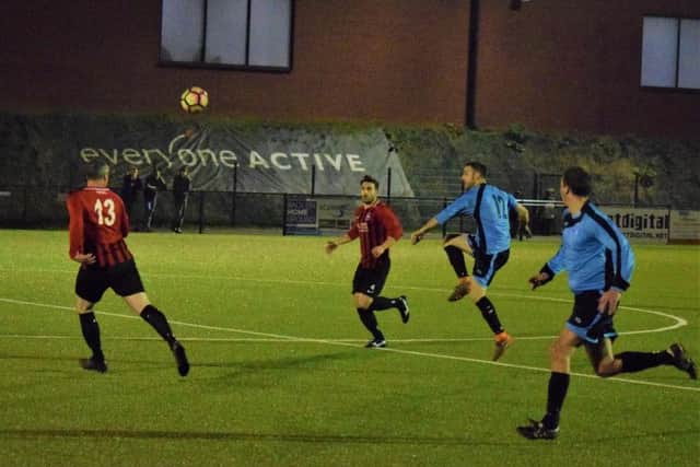 Action from the League Cup semi-final before it was prematurely abandoned due to crowd violence. Picture by Simon Dobson.