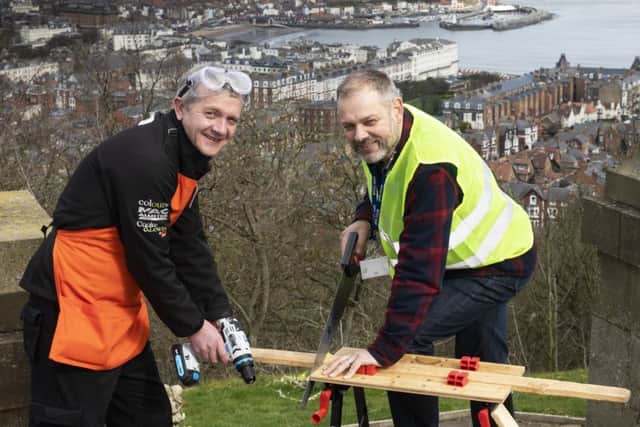 Charlie Macleod, manager of the B&Q store in Scarborough, and Ed Horwood, from the Youth Justice Service, try out the new equipment in Scarborough.