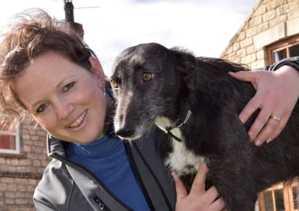 Emma Lund is pictured with her own dog Gypsy.