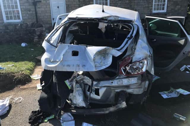 The damage to the car that crashed into a house.