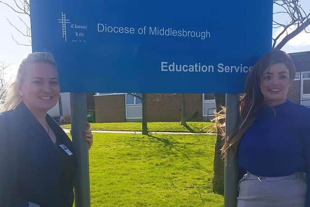 Natalie Foster and Megan Frederikson outside of St Augustine's School